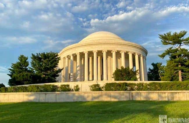 Jefferson Memorial a neoclassical building with dome and columns under a partly cloudy sky.