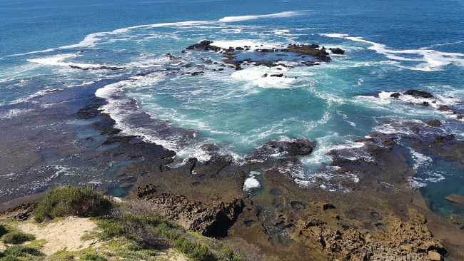 Tidal pool with turquoise water and rocky formations on Maui, Valley Isle.