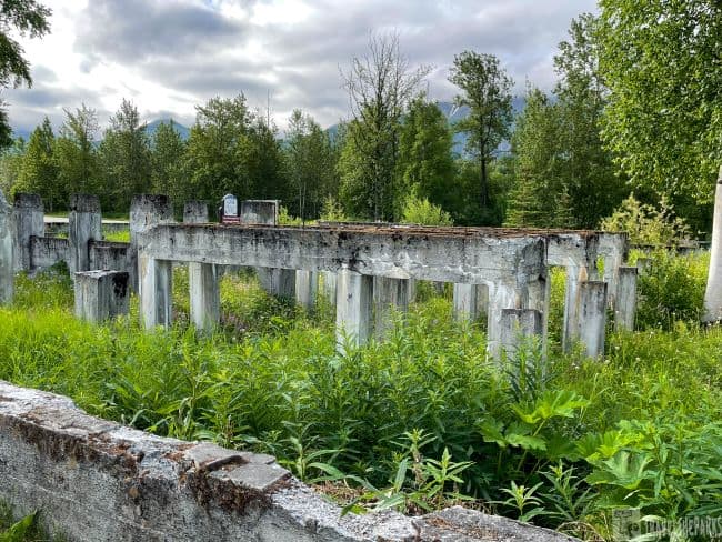 Alpine Historical Museum concrete remnants of the Sutton Coal Washery surrounded by lush vegetation and trees.