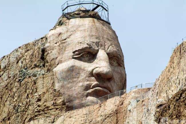 Close-up view of Crazy Horse Memorial with a detailed rock-carved face.