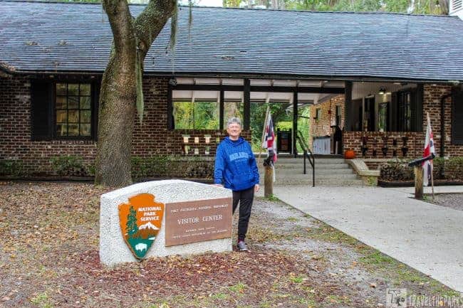 Women in front of visitor center sign Fort Frederica National Monument