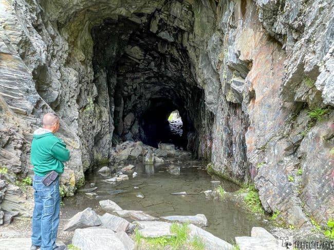 Railroad Tunnel Man standing at the entrance